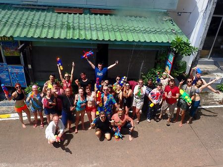 As friends instructors and divers having fun on celebration Thai new year “Songkran”